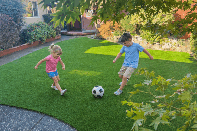 Children playing soccer in the backyard